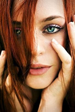 Face of a redhead with blue eyes