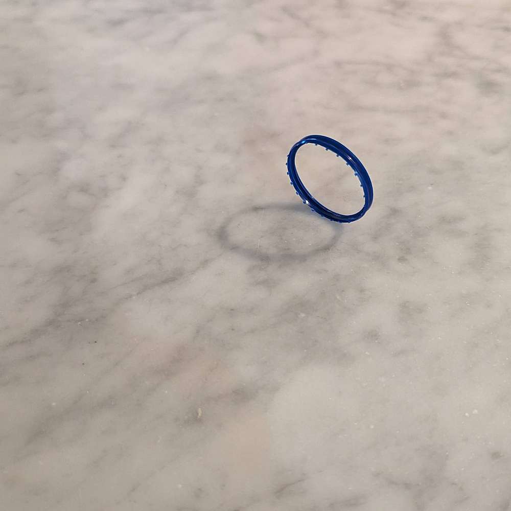 plastic ring on marble counter top