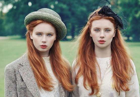 Twin redhead and blue-eyes beautiful girls