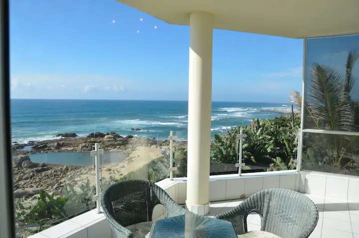 A view from a nice balcony overlooking a rocky beach