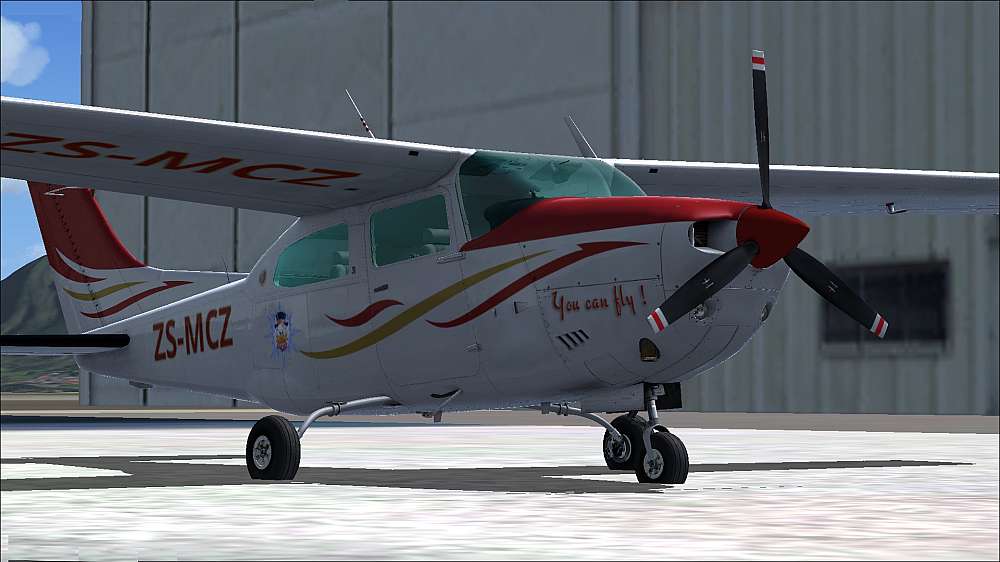 Princess Leia, a 1978 Cessna T210M sat on the apron in front of the AMO Hangar, gleaming in the morning sun. She was painted overall white with red and gold accents. The vertical stabilizer was painted red.