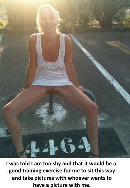 pantiless woman sitting on a metal bar exposing her pussy