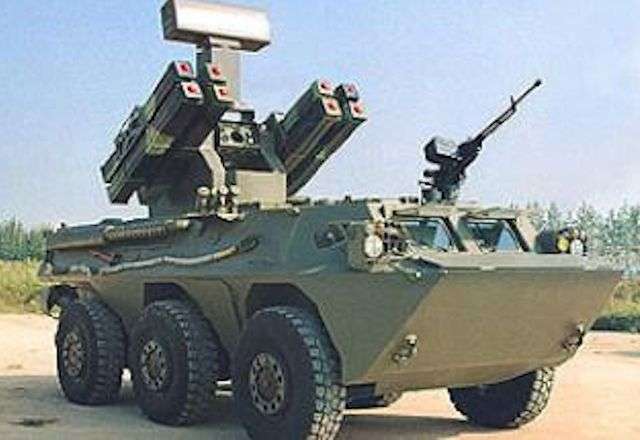 A WZ551, 6×6 IFV, mobile SAM system is seen filling the picture. The eight SAM missile launcher tubes point skyward at a 45 degree angle. On top of the launcher unit a radar dish points also towards a target.