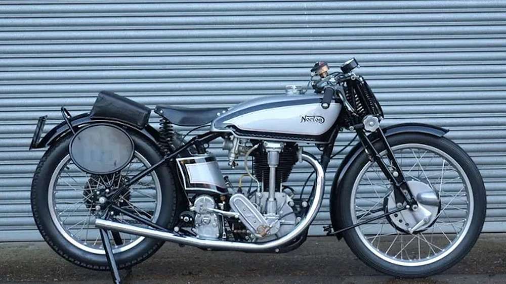 The picture show a 1934 Norton M30 motor cycle in pristine condition.