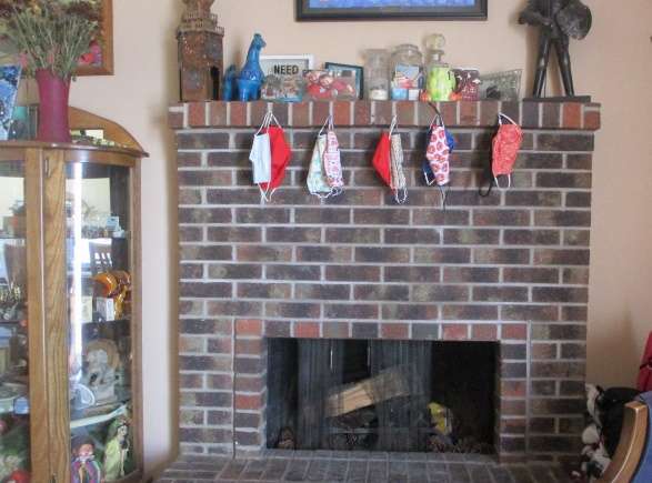 Facemasks on a fireplace