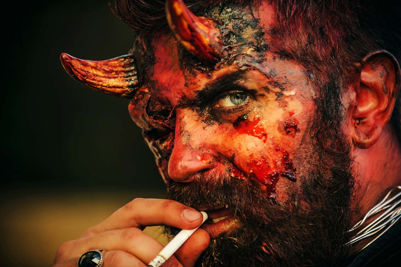 Devil smoking a cigar