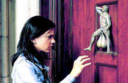 Girl Looking at an unusual Door knockers