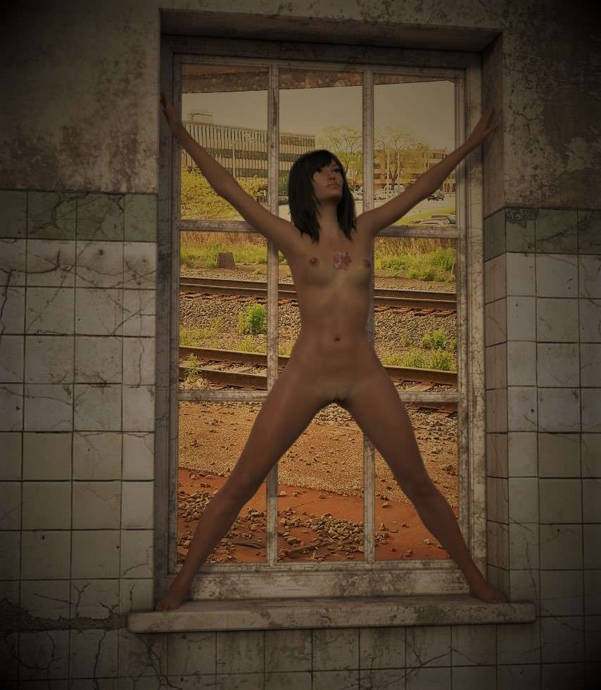 Naked woman standing in an abandonned building’s window