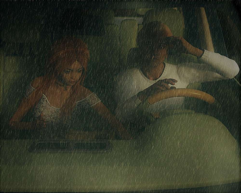 two people in a car while it rain really hard